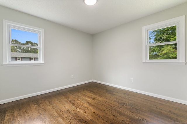 231 Lincolndale Dr, Waterbury, CT 06704 - empty room featuring baseboards and dark wood-type flooring