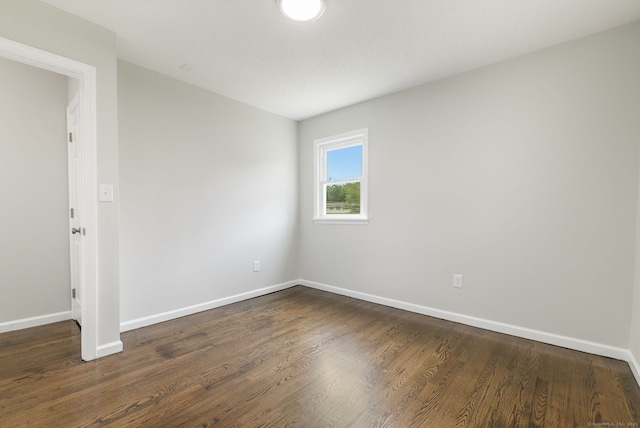 231 Lincolndale Dr, Waterbury, CT 06704 - spare room with baseboards and dark wood finished floors