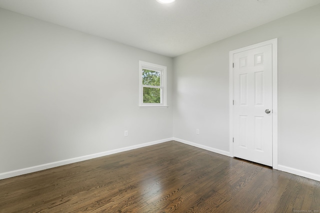 231 Lincolndale Dr, Waterbury, CT 06704 - spare room with baseboards and dark wood-style floors