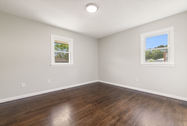 231 Lincolndale Dr, Waterbury, CT 06704 - unfurnished room with dark wood-style floors and baseboards