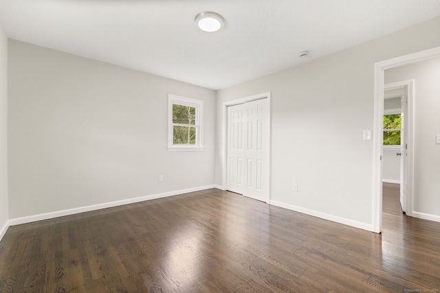231 Lincolndale Dr, Waterbury, CT 06704 - unfurnished bedroom with a closet and dark wood finished floors