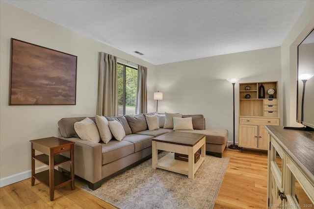 177 New Britain Ave Unit 177, Farmington, CT 06085 - living area with light wood-style floors and baseboards