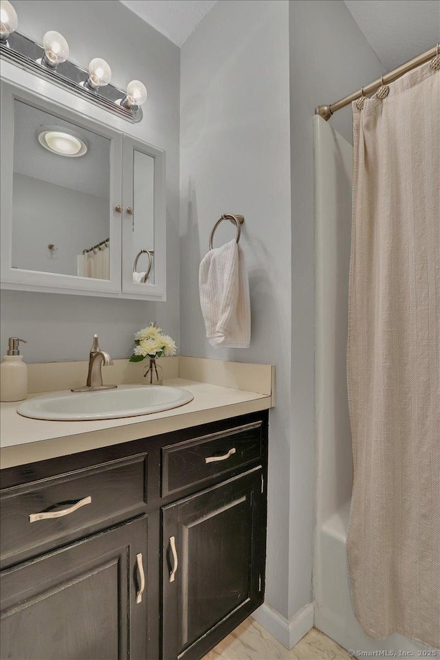 177 New Britain Ave Unit 177, Farmington, CT 06085 - bathroom featuring vanity, shower / bath combination with curtain, and marble finish floors