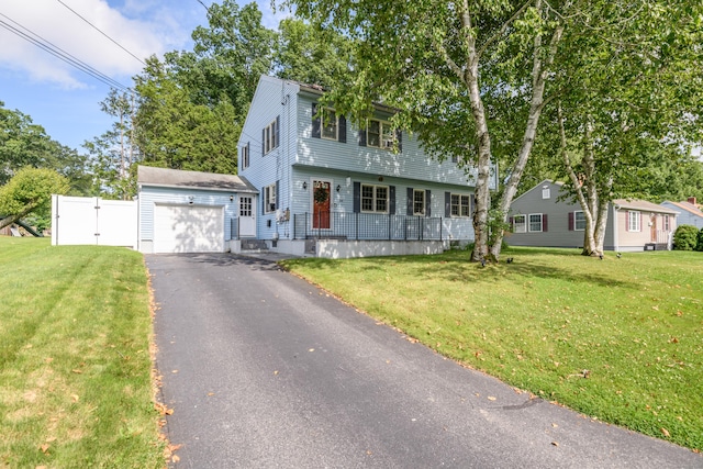 117 Woodside St, Putnam, CT 06260 - colonial inspired home featuring asphalt driveway and a gate