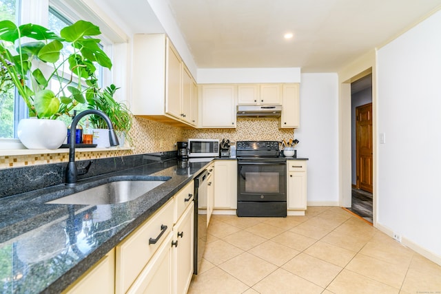 117 Woodside St, Putnam, CT 06260 - kitchen featuring black / electric stove, under cabinet range hood, tasteful backsplash, light tile patterned flooring, and stainless steel dishwasher