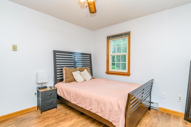 117 Woodside St, Putnam, CT 06260 - bedroom with light wood-style floors, a baseboard heating unit, and ceiling fan