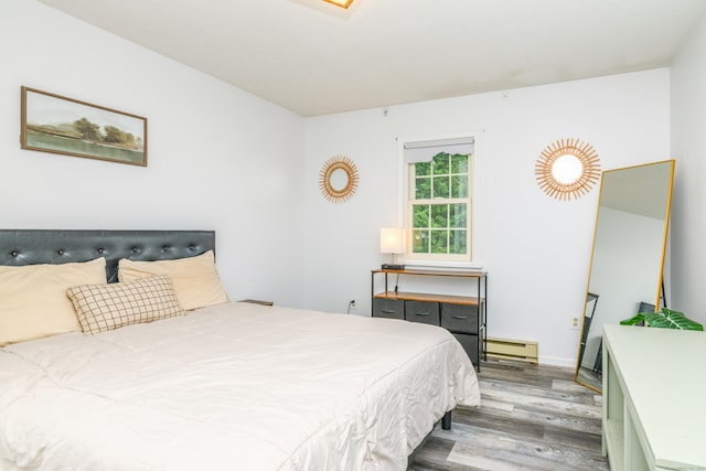 117 Woodside St, Putnam, CT 06260 - bedroom with baseboard heating and wood finished floors