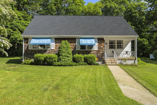 8 Nelson Dr, East Lyme, CT 06333 - view of front facade with a front yard, roof with shingles, and a porch