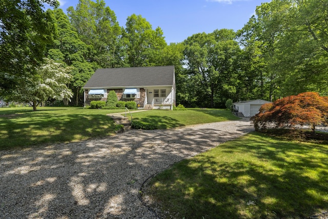 8 Nelson Dr, East Lyme, CT 06333 - view of front of home with a front yard, an outdoor structure, and a garage