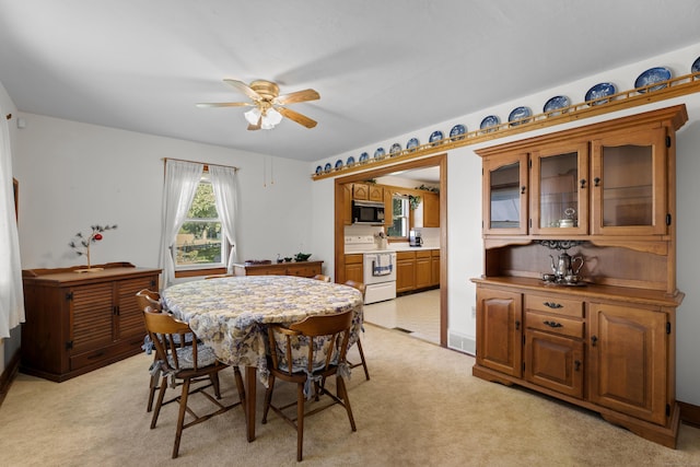 8 Nelson Dr, East Lyme, CT 06333 - dining room with a ceiling fan and light carpet