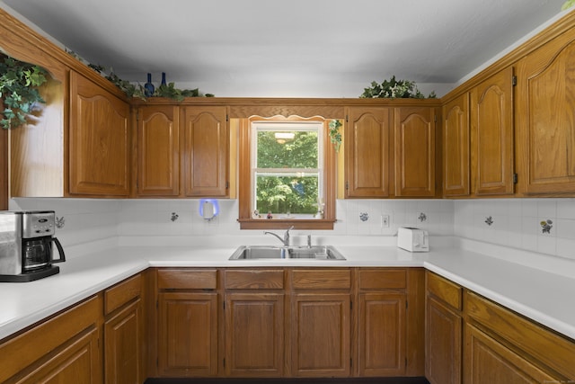 8 Nelson Dr, East Lyme, CT 06333 - kitchen featuring light countertops, tasteful backsplash, and brown cabinetry