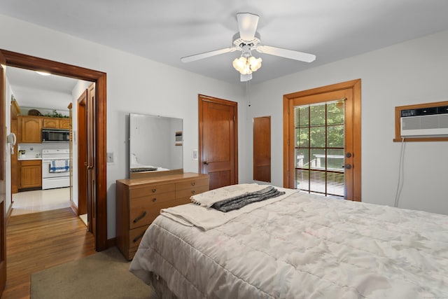 8 Nelson Dr, East Lyme, CT 06333 - bedroom with a wall unit AC, light wood finished floors, and ceiling fan