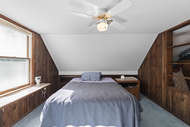 8 Nelson Dr, East Lyme, CT 06333 - bedroom with lofted ceiling, wood walls, carpet, and ceiling fan