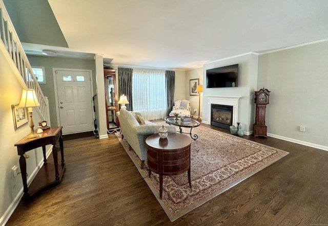 6005 Hancock Dr Unit 6005, Danbury, CT 06811 - living area featuring dark wood finished floors, a glass covered fireplace, plenty of natural light, and ornamental molding