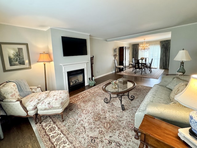 6005 Hancock Dr Unit 6005, Danbury, CT 06811 - living room featuring wood finished floors, a chandelier, crown molding, and a fireplace with flush hearth