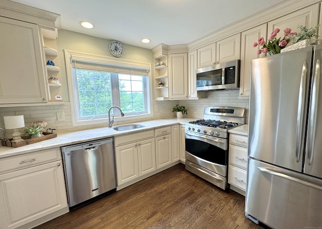 6005 Hancock Dr Unit 6005, Danbury, CT 06811 - kitchen with appliances with stainless steel finishes, open shelves, dark wood finished floors, tasteful backsplash, and recessed lighting