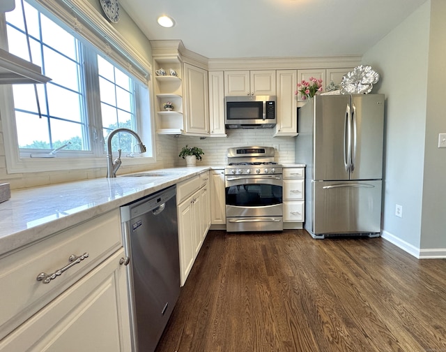 6005 Hancock Dr Unit 6005, Danbury, CT 06811 - kitchen with appliances with stainless steel finishes, dark wood-style floors, tasteful backsplash, light stone countertops, and recessed lighting
