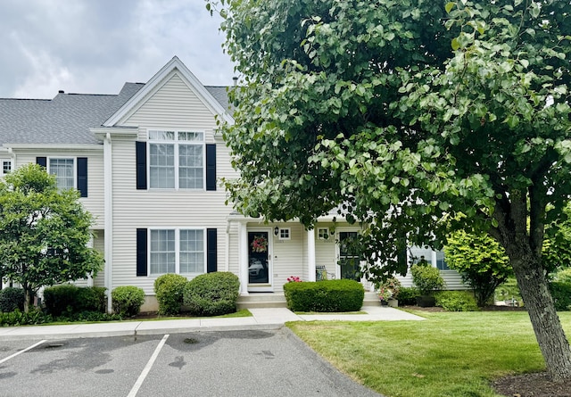 6005 Hancock Dr Unit 6005, Danbury, CT 06811 - view of front facade with uncovered parking and a front lawn