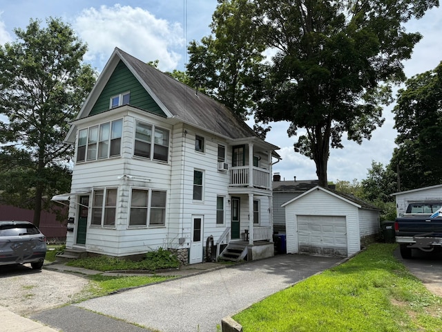 34 Oak St, Thomaston, CT 06787 - view of front of house featuring a garage, a balcony, driveway, and an outdoor structure