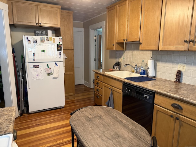 34 Oak St, Thomaston, CT 06787 - kitchen featuring freestanding refrigerator, black dishwasher, wood finished floors, and tasteful backsplash