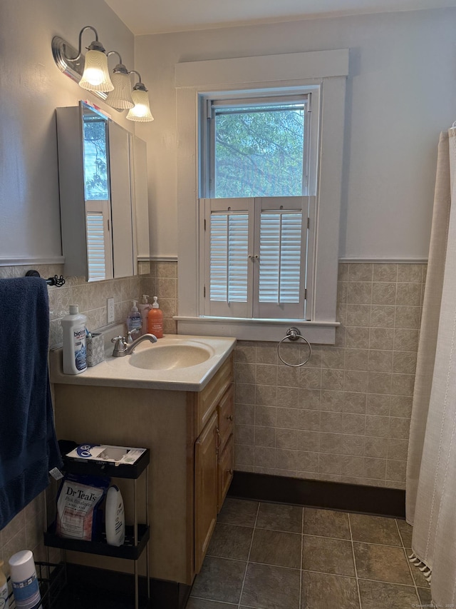 34 Oak St, Thomaston, CT 06787 - full bathroom featuring tile walls, vanity, wainscoting, and tile patterned flooring