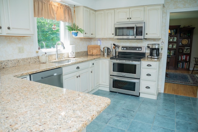 95 Holly Mar Hill Rd, North Branford, CT 06472 - kitchen featuring stainless steel appliances and light stone countertops
