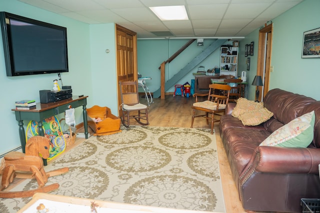 95 Holly Mar Hill Rd, North Branford, CT 06472 - living room featuring wood finished floors, stairway, and a paneled ceiling