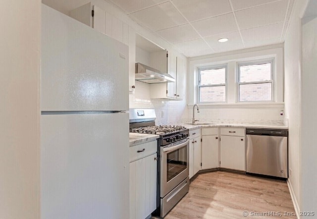 77 Glenbrook Rd Apt 203, Stamford, CT 06902 - kitchen with appliances with stainless steel finishes, extractor fan, light wood-type flooring, backsplash, and a drop ceiling
