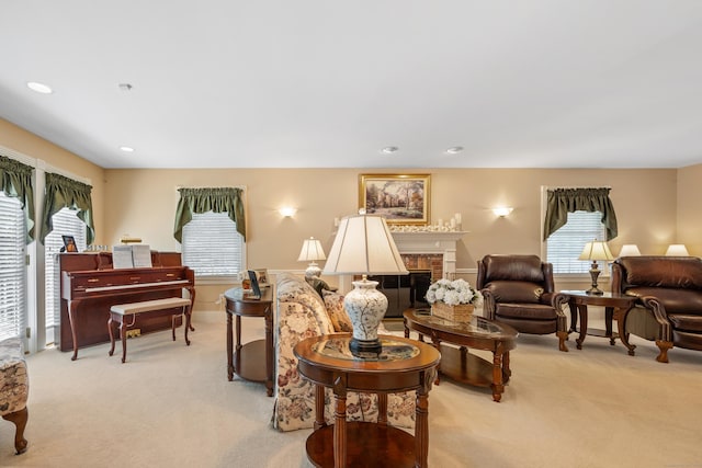 12 Marc Dr, Watertown, CT 06795 - living area with light colored carpet, a fireplace, and recessed lighting