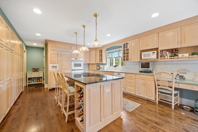 12 Marc Dr, Watertown, CT 06795 - kitchen with white appliances, light brown cabinetry, a center island, glass insert cabinets, and a kitchen breakfast bar