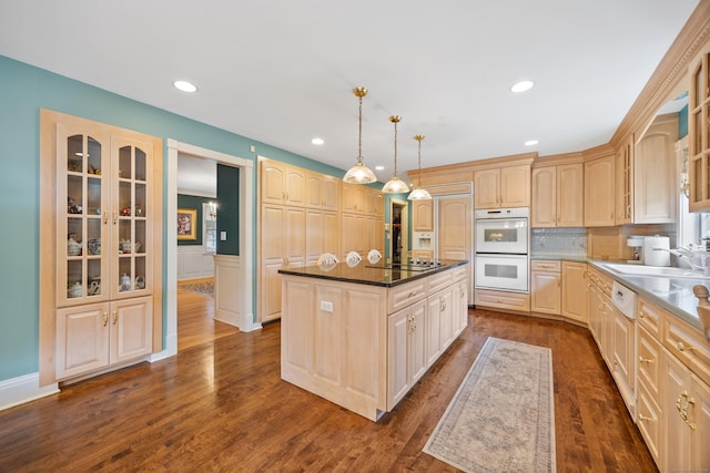 12 Marc Dr, Watertown, CT 06795 - kitchen featuring white double oven, a kitchen island, glass insert cabinets, light brown cabinetry, and dark wood-type flooring