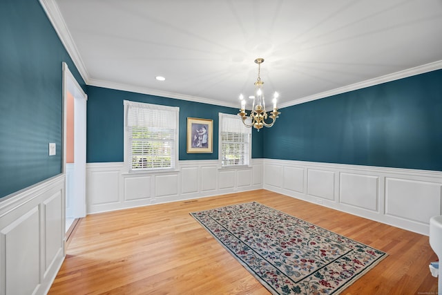 12 Marc Dr, Watertown, CT 06795 - unfurnished dining area with a chandelier, crown molding, a wainscoted wall, wood finished floors, and recessed lighting