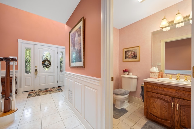 12 Marc Dr, Watertown, CT 06795 - entryway featuring light tile patterned floors and a wainscoted wall