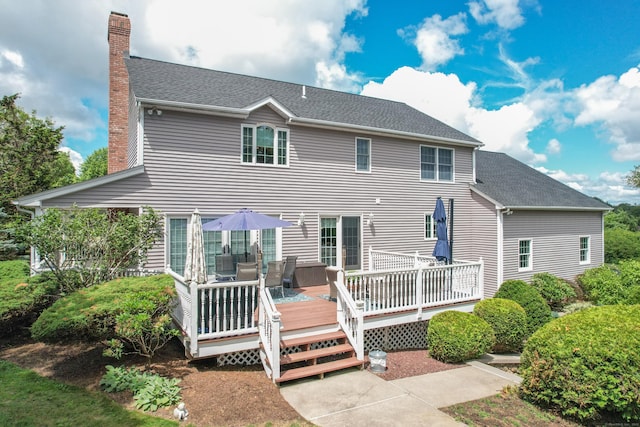 12 Marc Dr, Watertown, CT 06795 - rear view of house with a chimney and a wooden deck