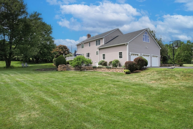 12 Marc Dr, Watertown, CT 06795 - view of home's exterior featuring a chimney, a garage, a lawn, and driveway