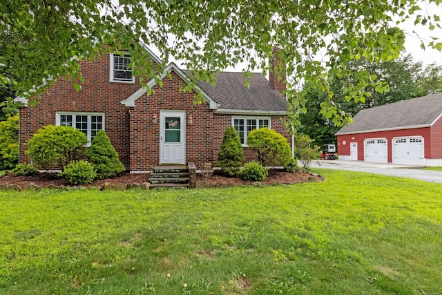 534 Norwich Ave, Colchester, CT 06415 - view of front of home featuring a chimney, a front yard, brick siding, and a detached garage