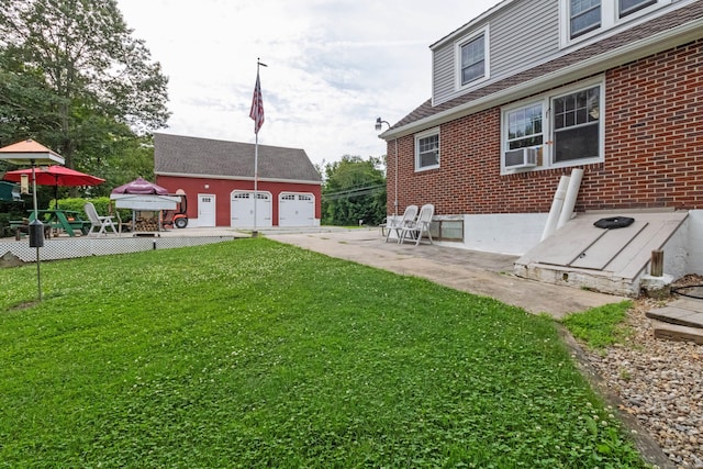 534 Norwich Ave, Colchester, CT 06415 - view of green lawn featuring an outdoor structure, a detached garage, cooling unit, and driveway
