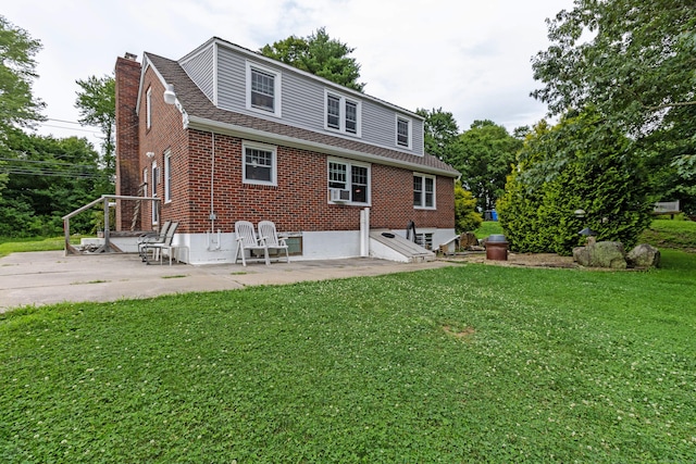 534 Norwich Ave, Colchester, CT 06415 - back of house featuring brick siding, a chimney, a lawn, a patio area, and a shingled roof