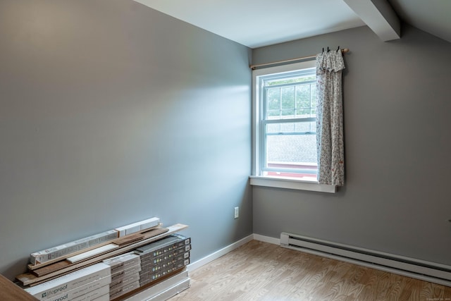 534 Norwich Ave, Colchester, CT 06415 - empty room with a baseboard heating unit and wood finished floors