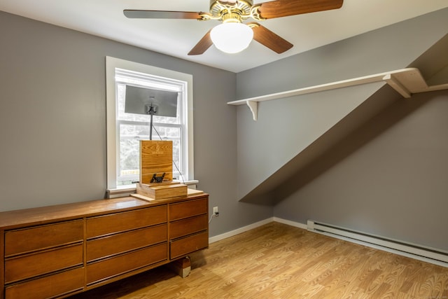 534 Norwich Ave, Colchester, CT 06415 - spacious closet featuring light wood finished floors, a baseboard radiator, and a ceiling fan