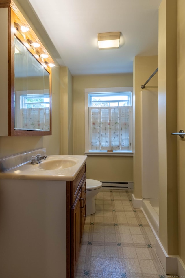 534 Norwich Ave, Colchester, CT 06415 - bathroom with a baseboard heating unit, vanity, tile patterned floors, and a shower