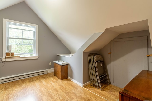534 Norwich Ave, Colchester, CT 06415 - bonus room with a baseboard heating unit, light wood-type flooring, and lofted ceiling