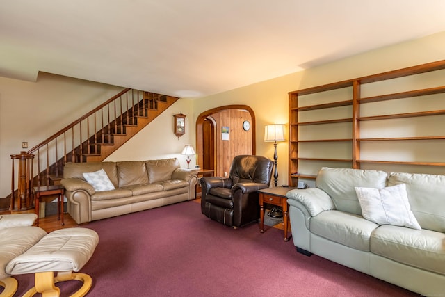 534 Norwich Ave, Colchester, CT 06415 - living area with arched walkways, stairs, and carpet