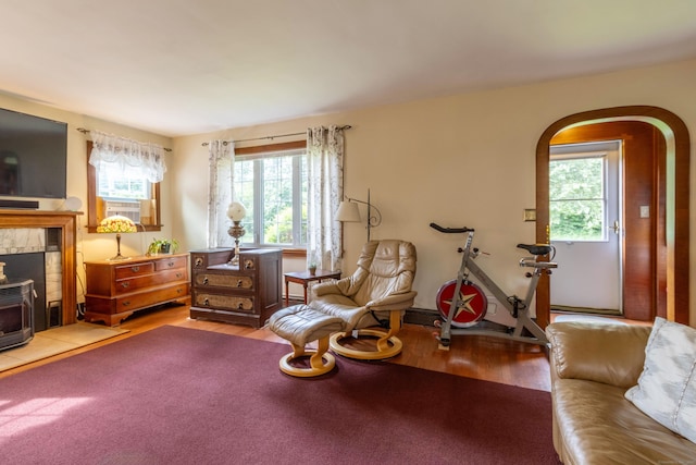 534 Norwich Ave, Colchester, CT 06415 - living area with healthy amount of natural light, light wood-type flooring, arched walkways, and cooling unit