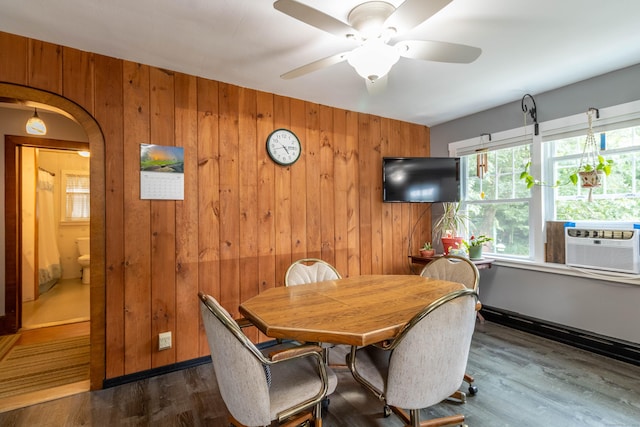 534 Norwich Ave, Colchester, CT 06415 - dining area with wooden walls, healthy amount of natural light, dark wood-type flooring, and ceiling fan