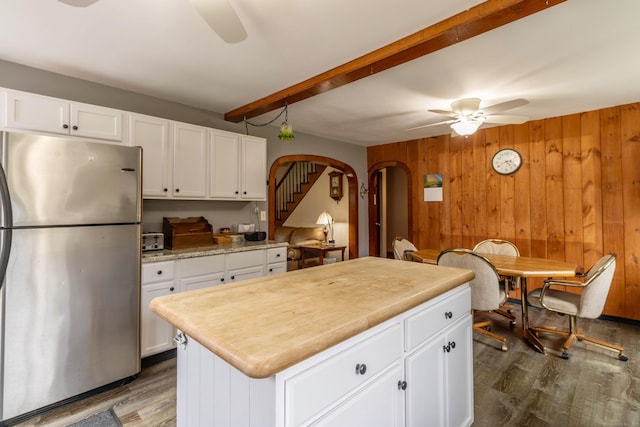 534 Norwich Ave, Colchester, CT 06415 - kitchen featuring freestanding refrigerator, a ceiling fan, arched walkways, dark wood-type flooring, and beam ceiling