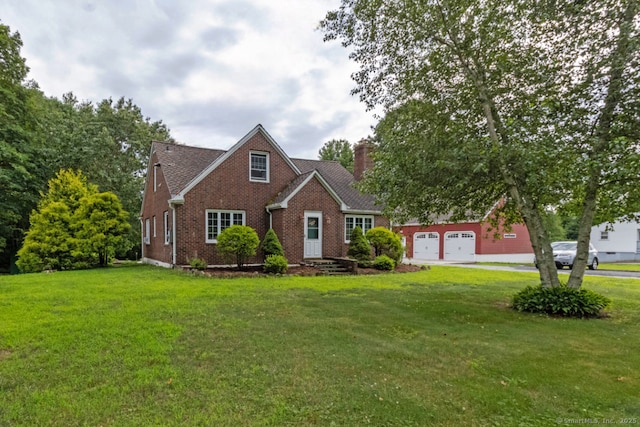 534 Norwich Ave, Colchester, CT 06415 - view of front of house featuring brick siding, a front lawn, a chimney, and driveway