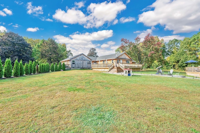 33 Seymour Rd, East Granby, CT 06026 - view of green lawn with a wooden deck and stairway