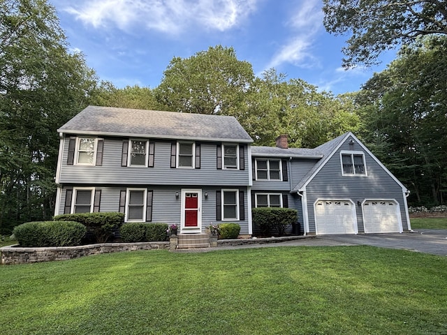 11 Obed Hts, Old Saybrook, CT 06475 - colonial-style house featuring asphalt driveway, a front lawn, and a chimney