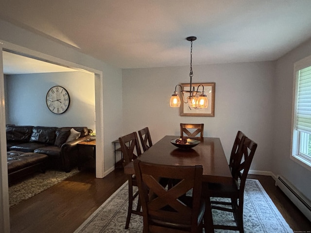11 Obed Hts, Old Saybrook, CT 06475 - dining space with baseboard heating, wood finished floors, and a chandelier